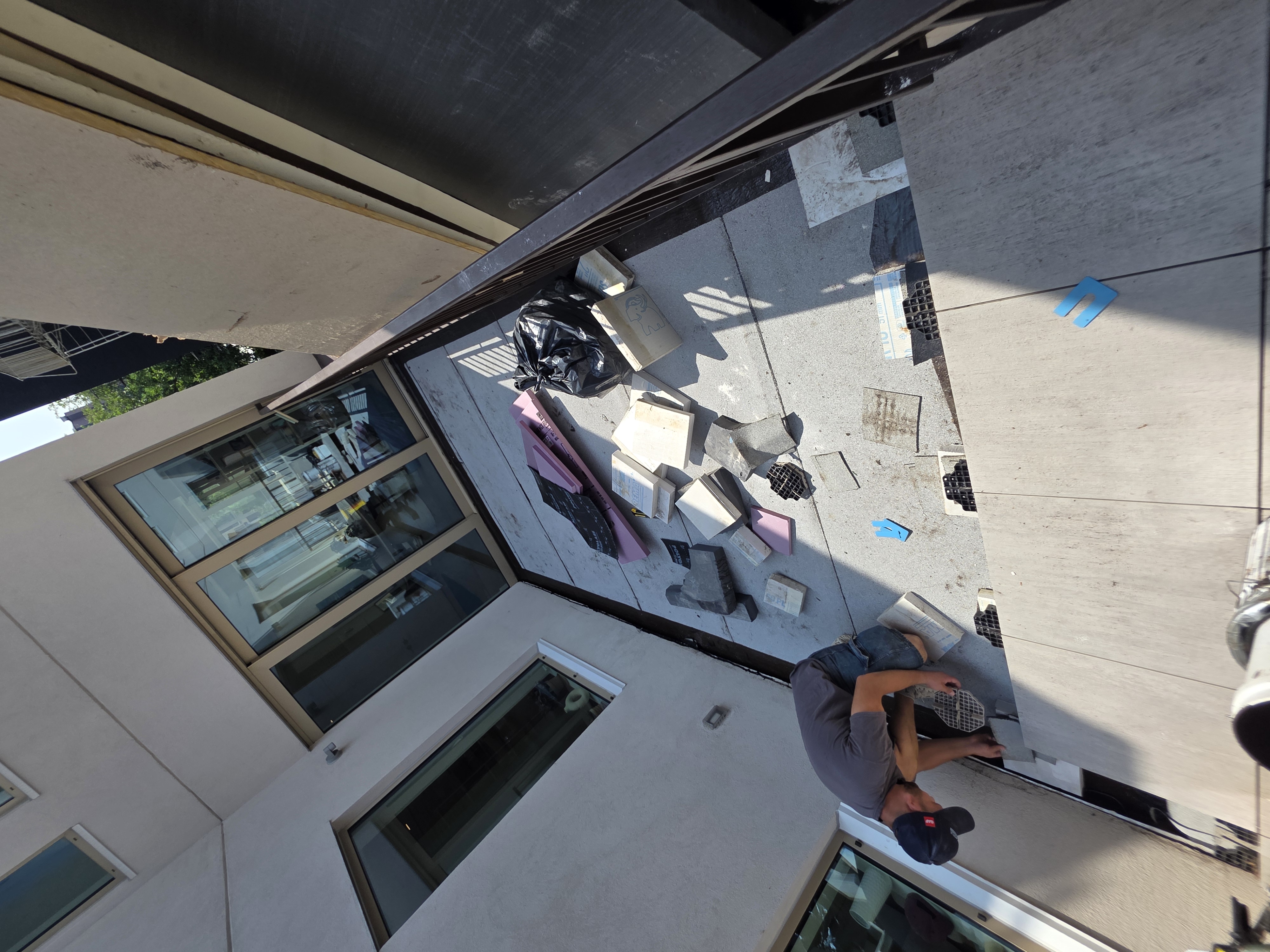 Deck tile installation in progress on a Brooklyn rooftop